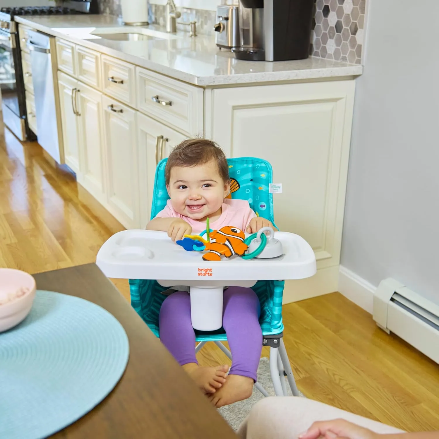 Bright Starts Disney Baby Finding Nemo Pop ‘n Dine Portable Highchair, Suction Cup Nemo Toy, Space Saving High Chair for Indoor/Outdoor Dining with Fast, Easy, Compact Fold, 6 Months - 45 Pounds